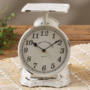 image of metal vintage scale with a clock on a tabletop
